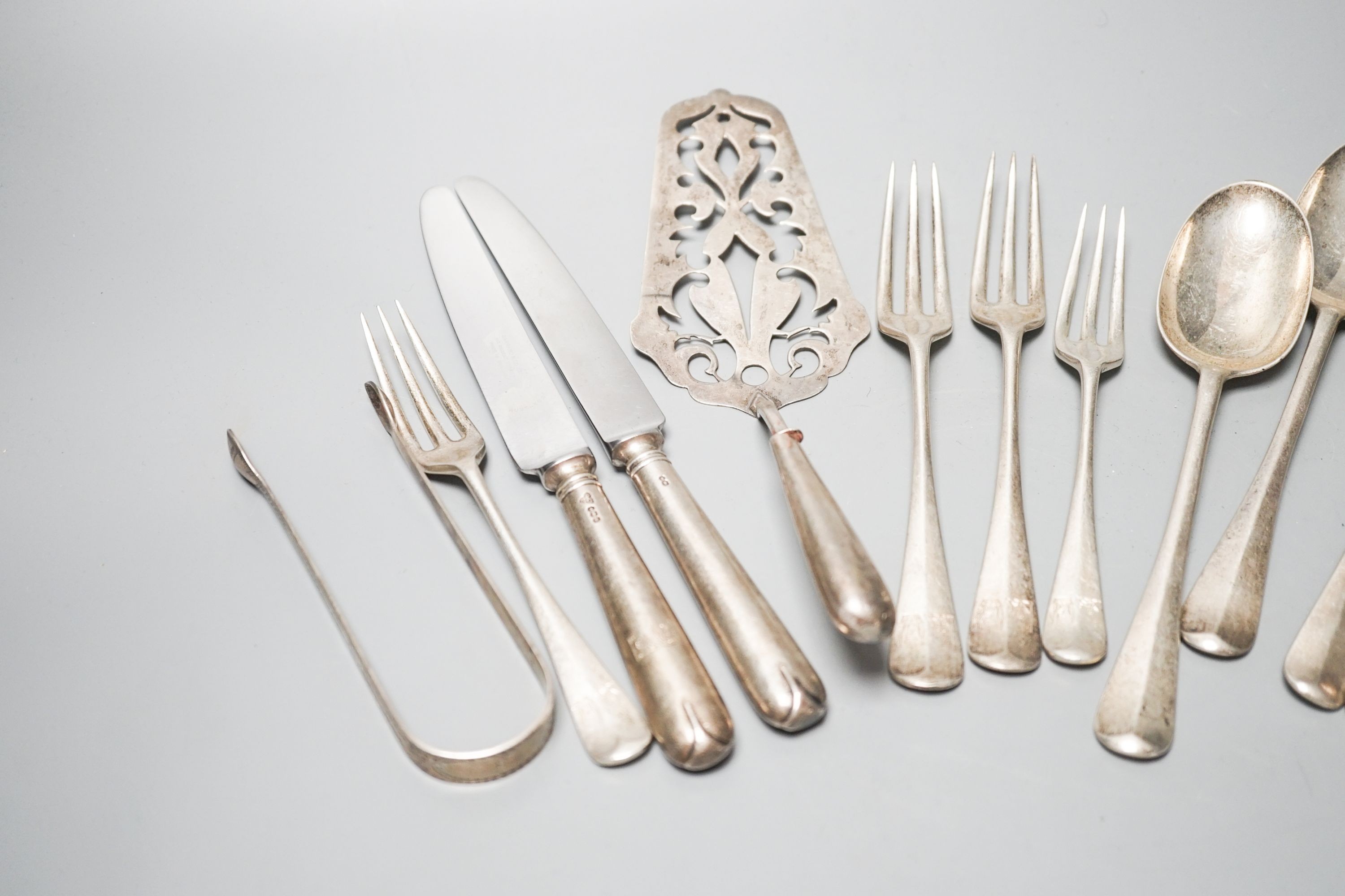 Mixed flatware including a Georgian silver sifter spoon, white metal cake slice, silver three pronged forks etc.